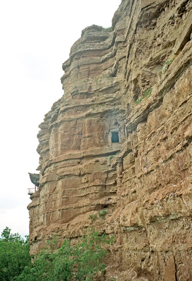 old Buddhist caves in the cliff face