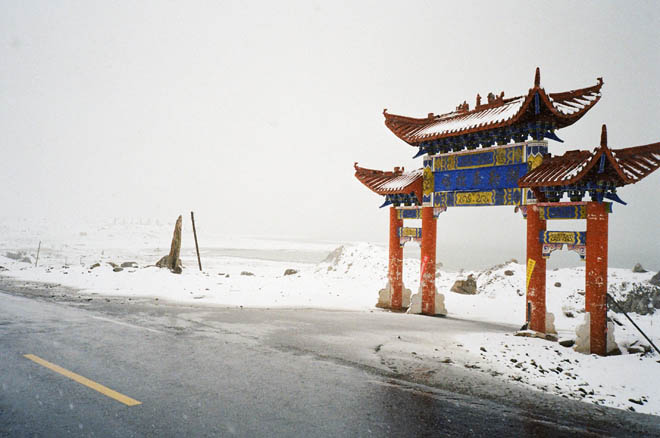 snow on the gates of turist hotel at Karakul