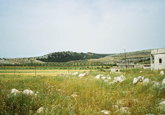 a rocky hill, on which the monastery of St. Simeon Stylite resides