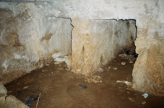 inside of a large rock tomb