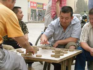Uighur men playing backgammon