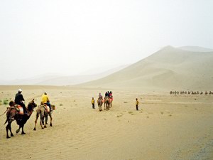 Chineese tourists in the sand dunes